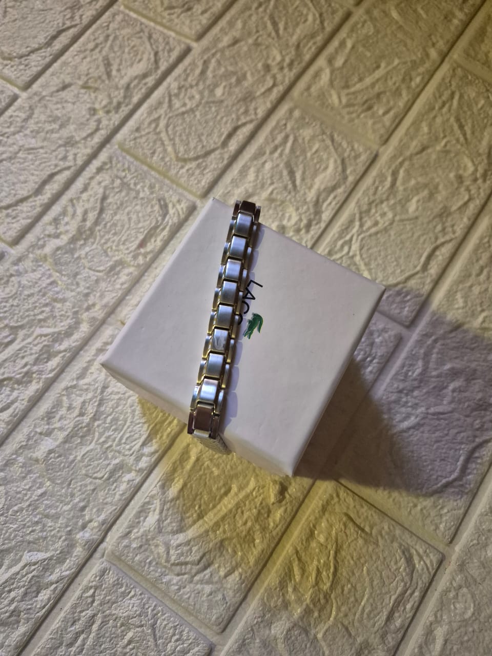 silver Lacoste bracelet